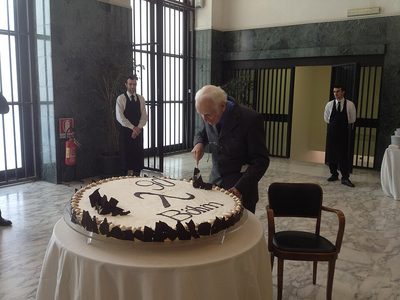 Corrado Böhm cutting a cake at his 90th-birthday celebration at the ETAPS conference in 2013